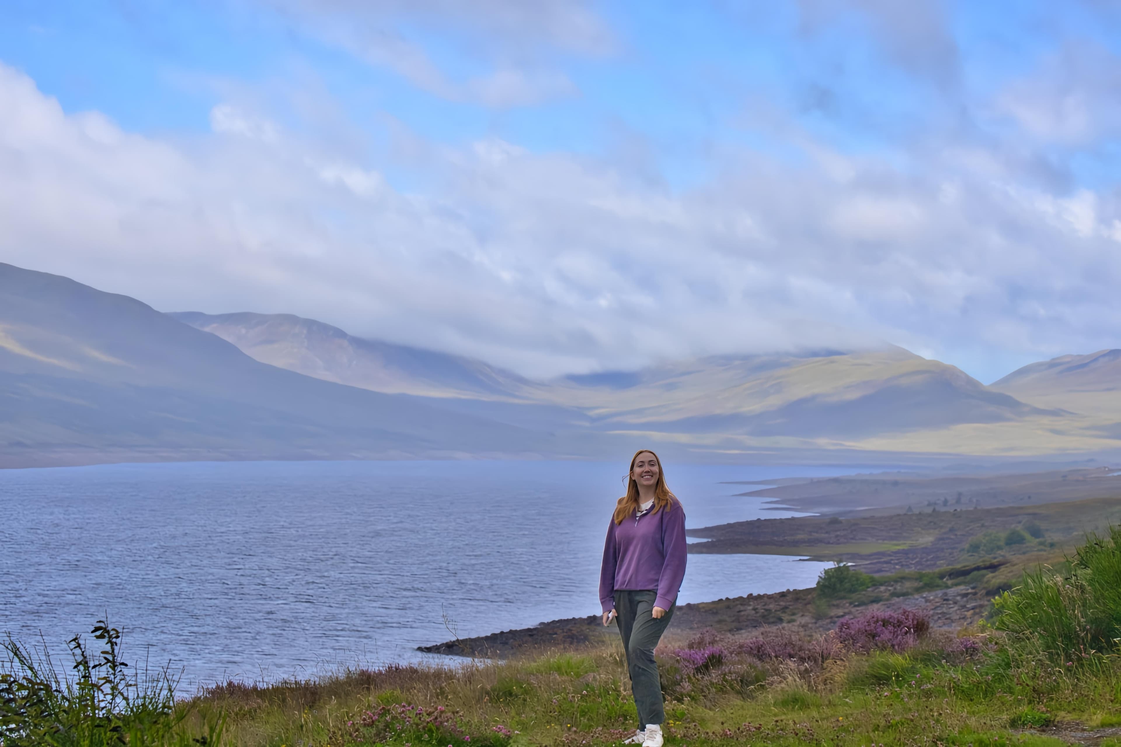 Hero — Erin standing in front of a landscape